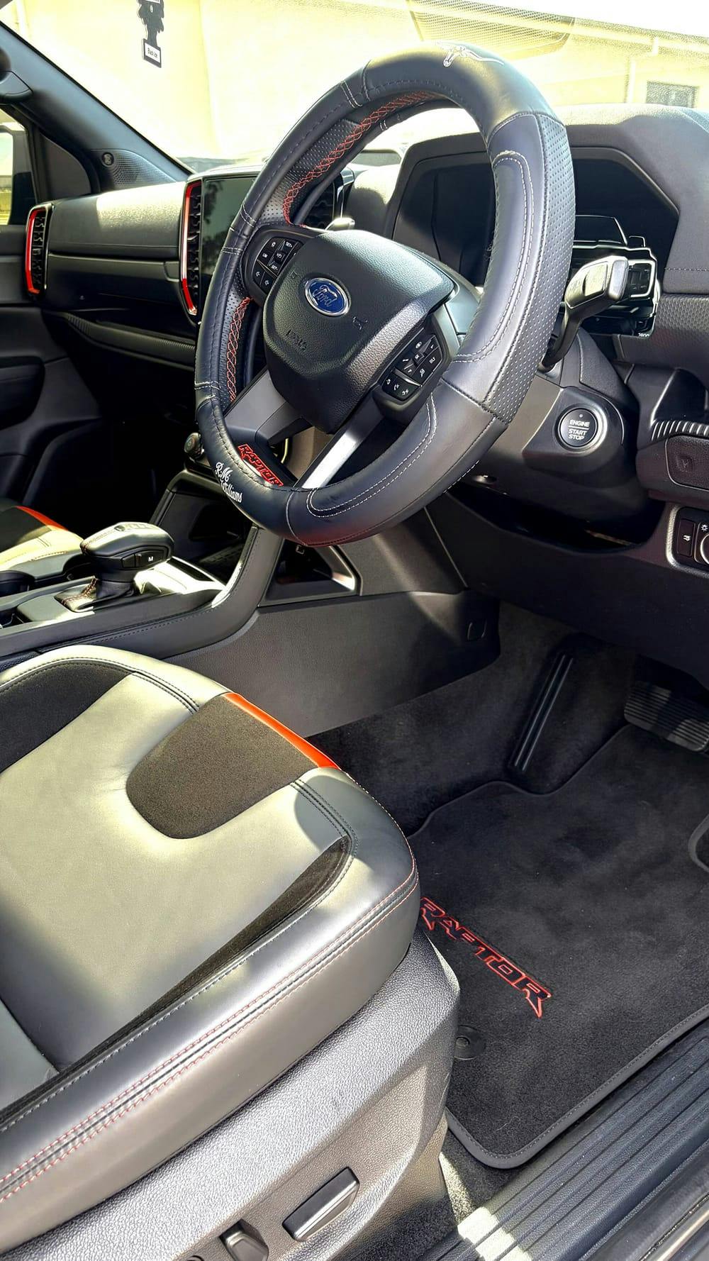 Detailed Ford Ranger interior: steering wheel, console and floor mats cleaned to a fresh finish