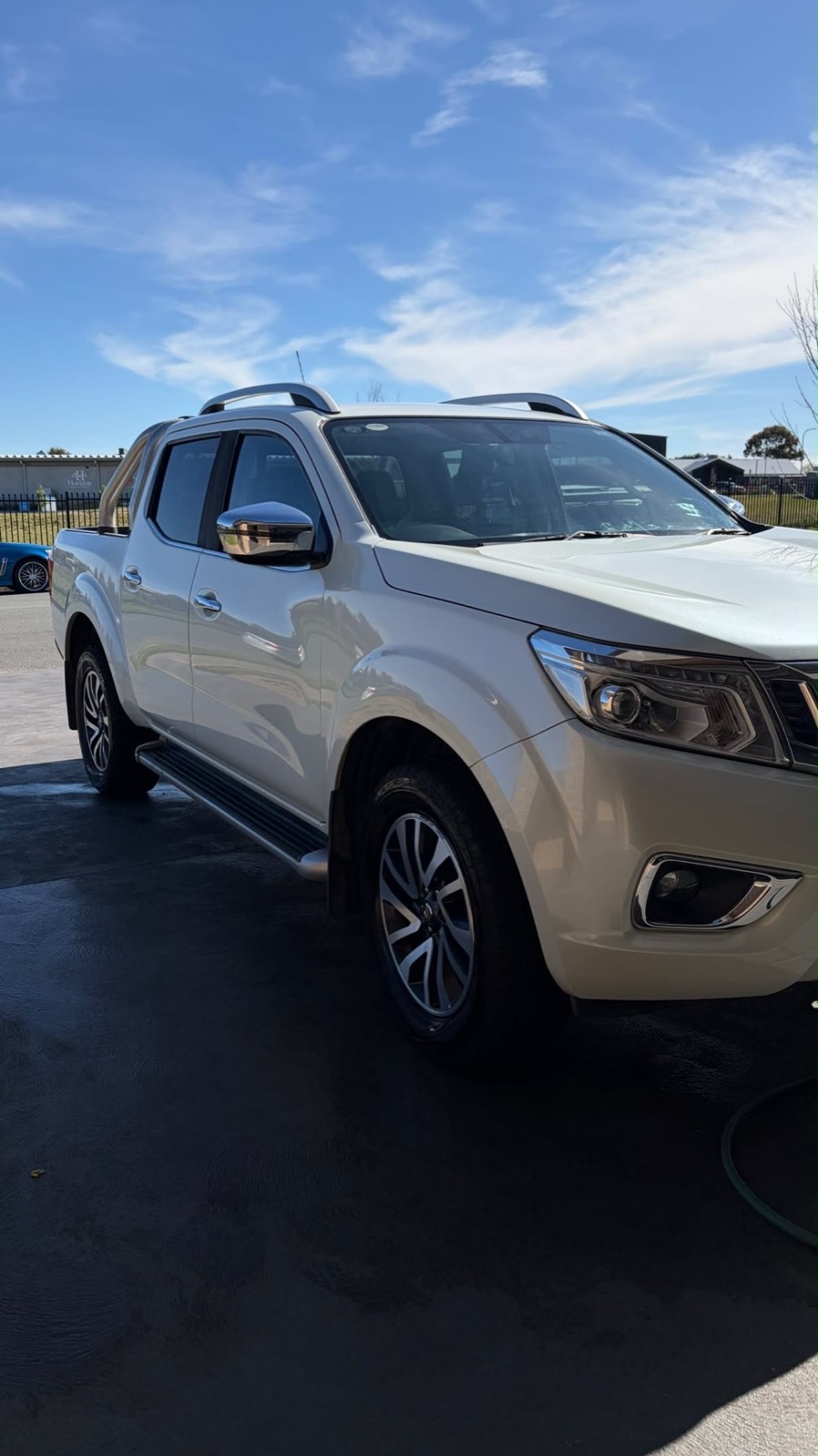 White Nissan Navara after an exterior wash and detail, paint and chrome clean